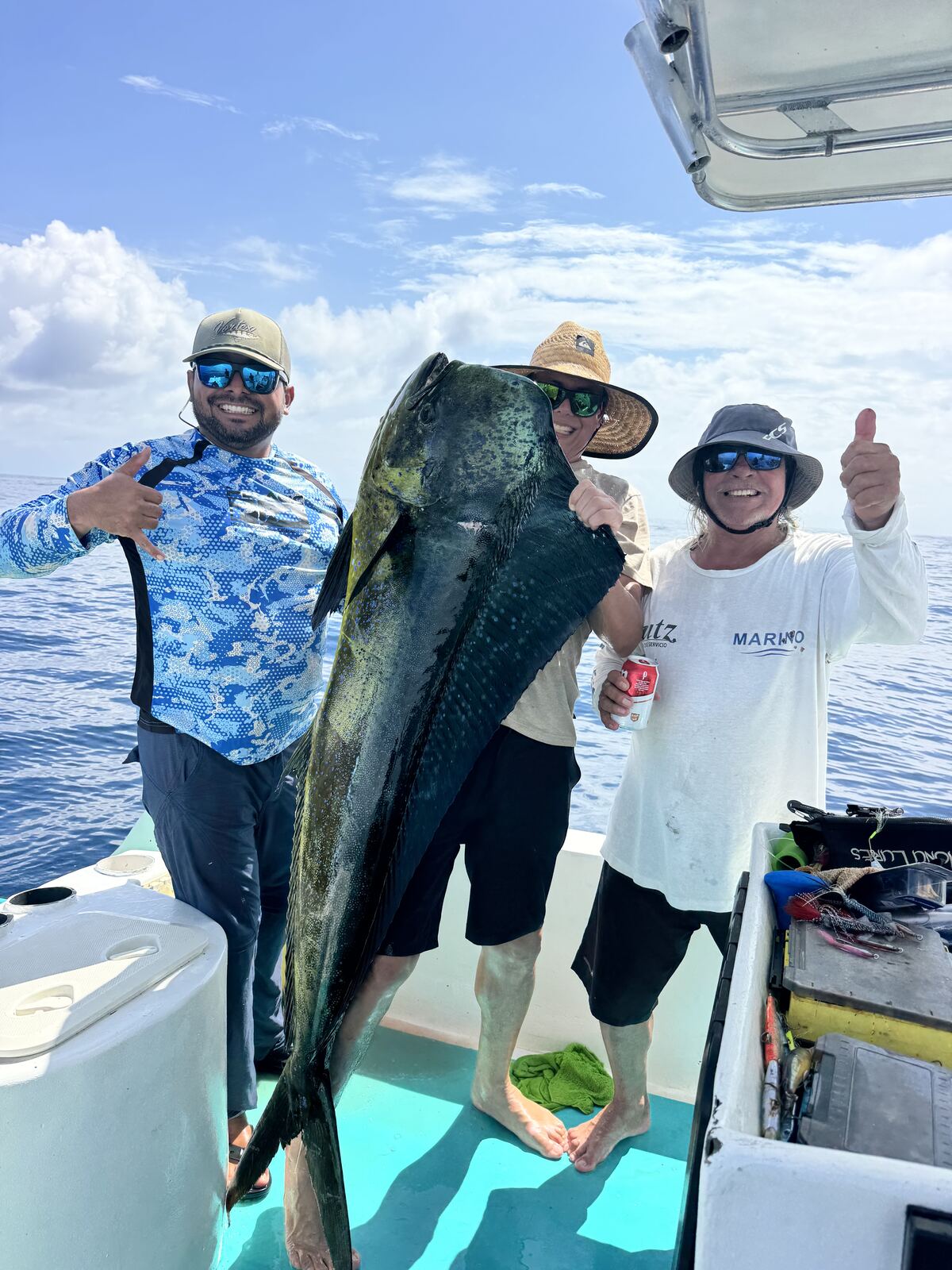 Group celebrating a big mahi-mahi catch