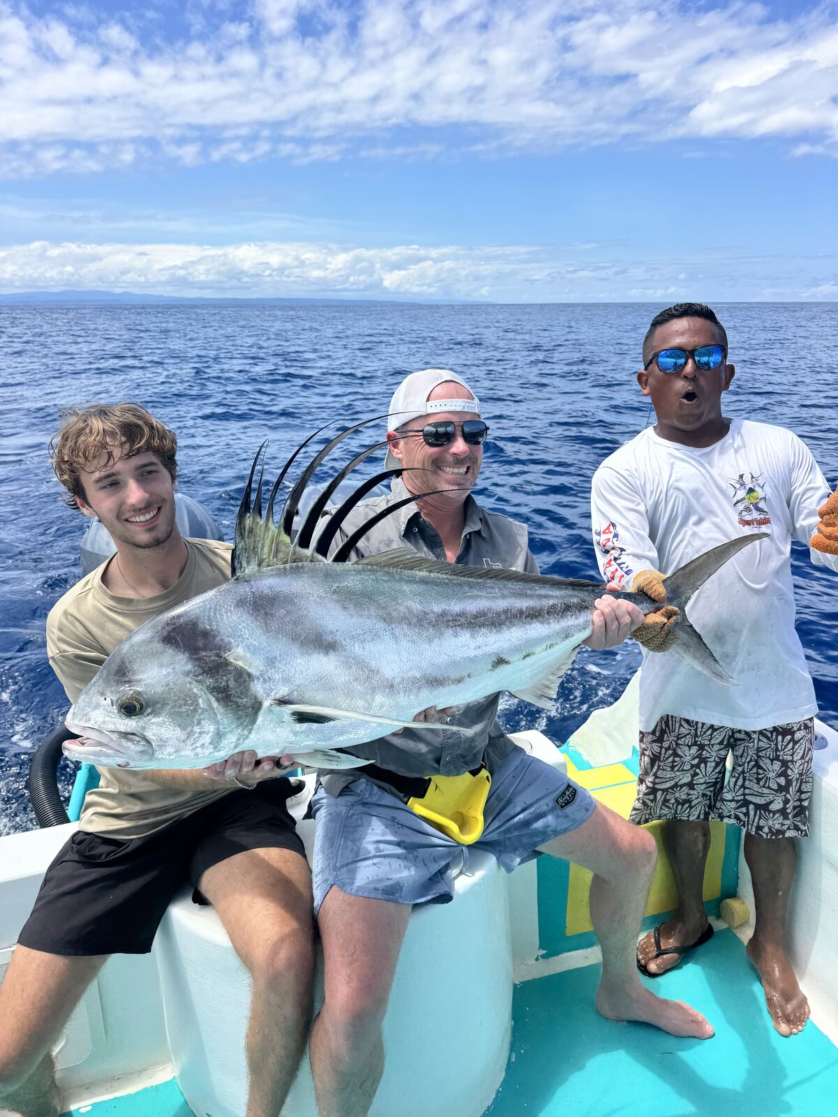 Crew with a caught roosterfish