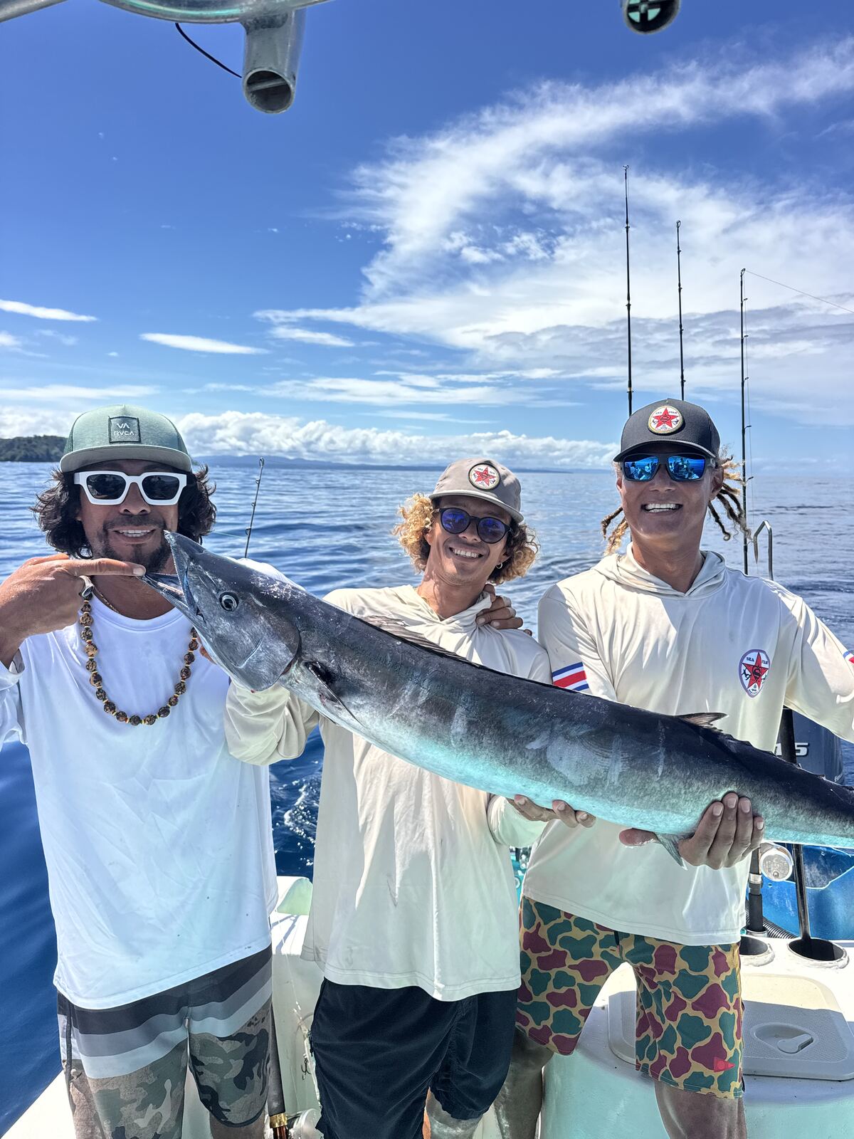 A group of friends with a caught wahoo
